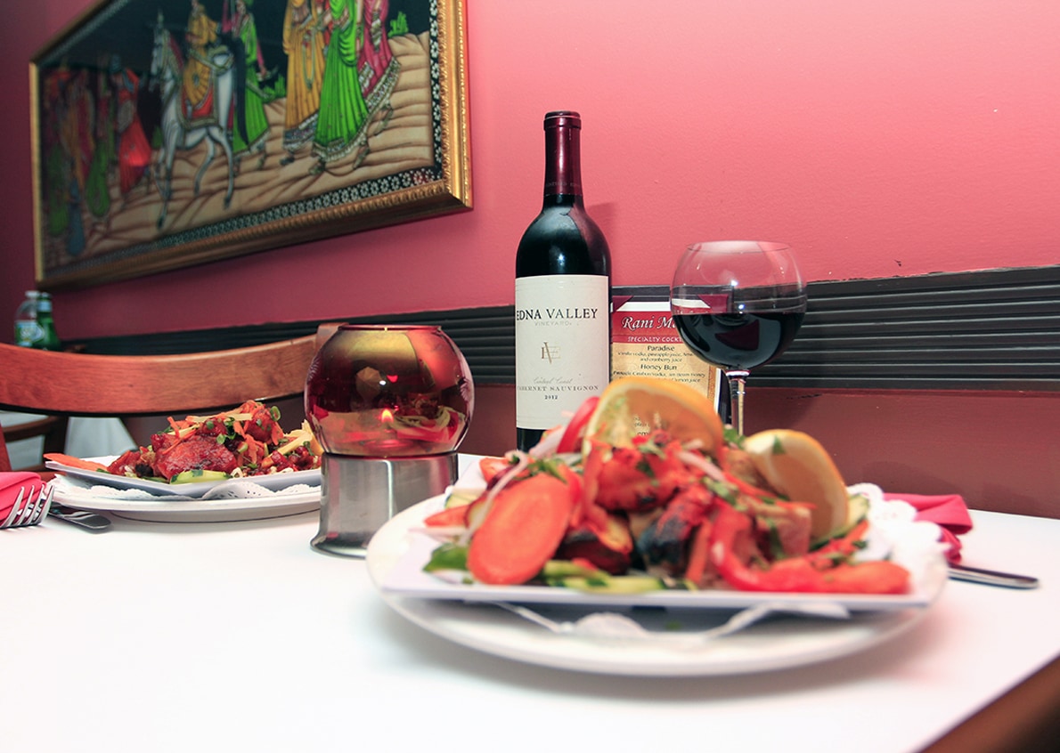 A table set with wine and appetizers